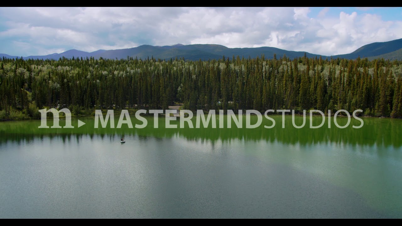 Big Bar Lake BC aerial approach to boat launch passing angler fishing