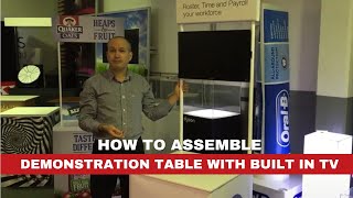 Demonstration table with TV built in