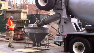 Http://www.vancesova.com watch concrete mixer truck working and
pouring into a bucket that is shaped like funnel. the li...