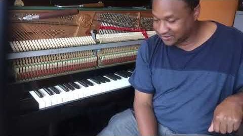 Kris Nicholson breaks a string on a Kawai Upright Piano