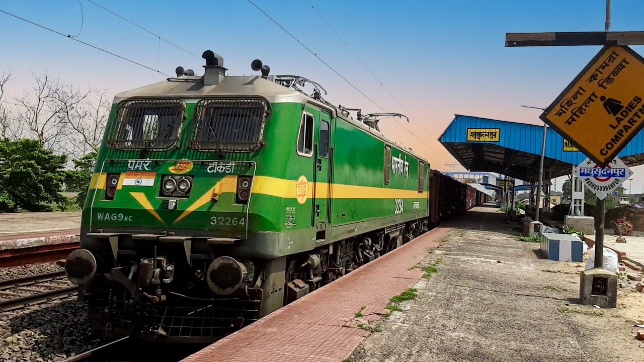 High speed TKD WAG-9 HC leading overloaded BOXN wagons freight train