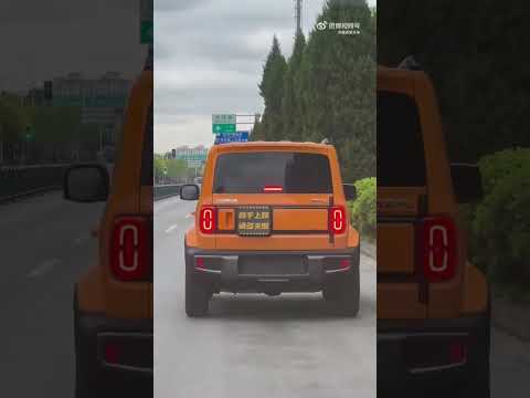 Baojun Yep Car-watch displaying messages to a driver behind him