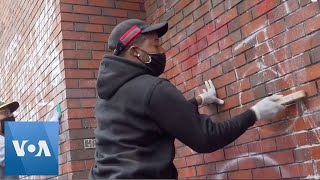 Volunteers  Sweep Up Cities Morning After Protests