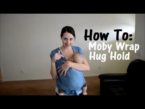 newborn hug hold moby