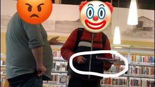 Burning a book inside a LIBRARY