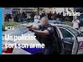 Paris vis par des projectiles un policier braque son arme sur des manifestants