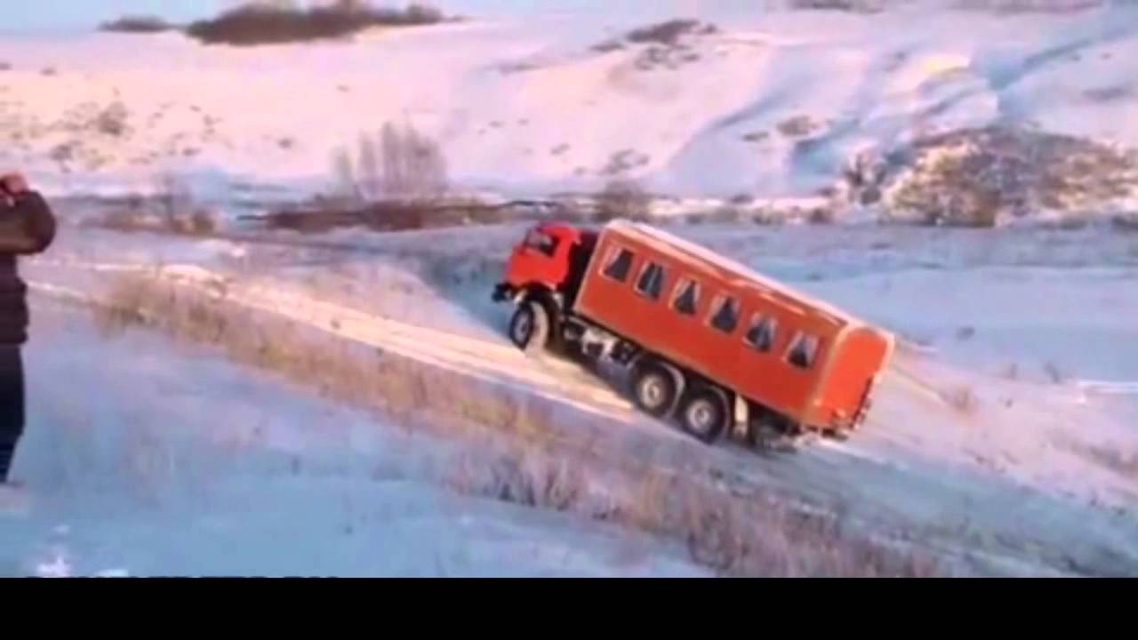 Russian man drives up the hill and slides down sideways