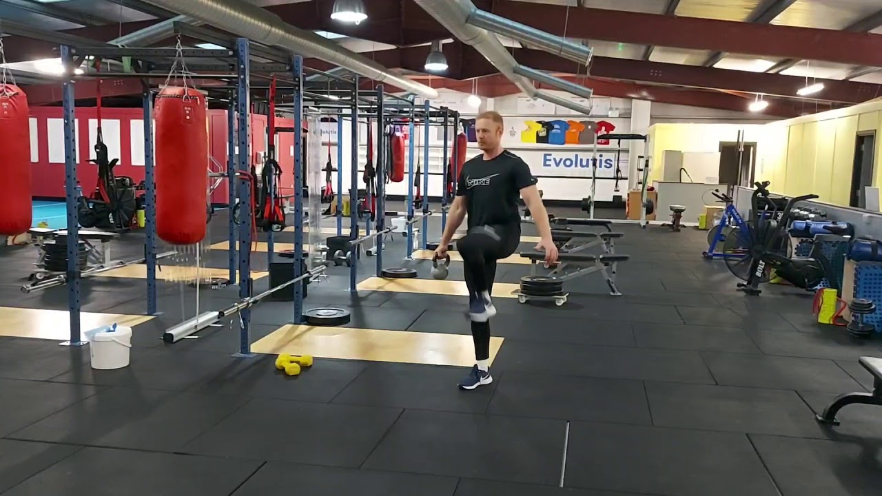 Evolutis.ie Suitcase hold with walking march core strength exercise