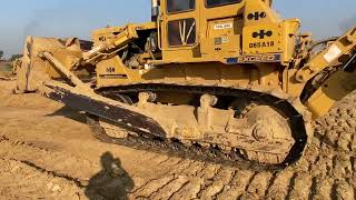 Caterpillar D85 A18 XL bulldozer operator is very good at working to smooth plantation roads