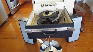 Motorola Hi-Fi STEREO record player playing a stack of 45 RPM, 7" records. 78