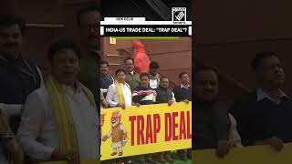 Suspended Congress MPs’ protest holding ‘Trap Deal’ banner at Makar Dwar over India-US Trade deal