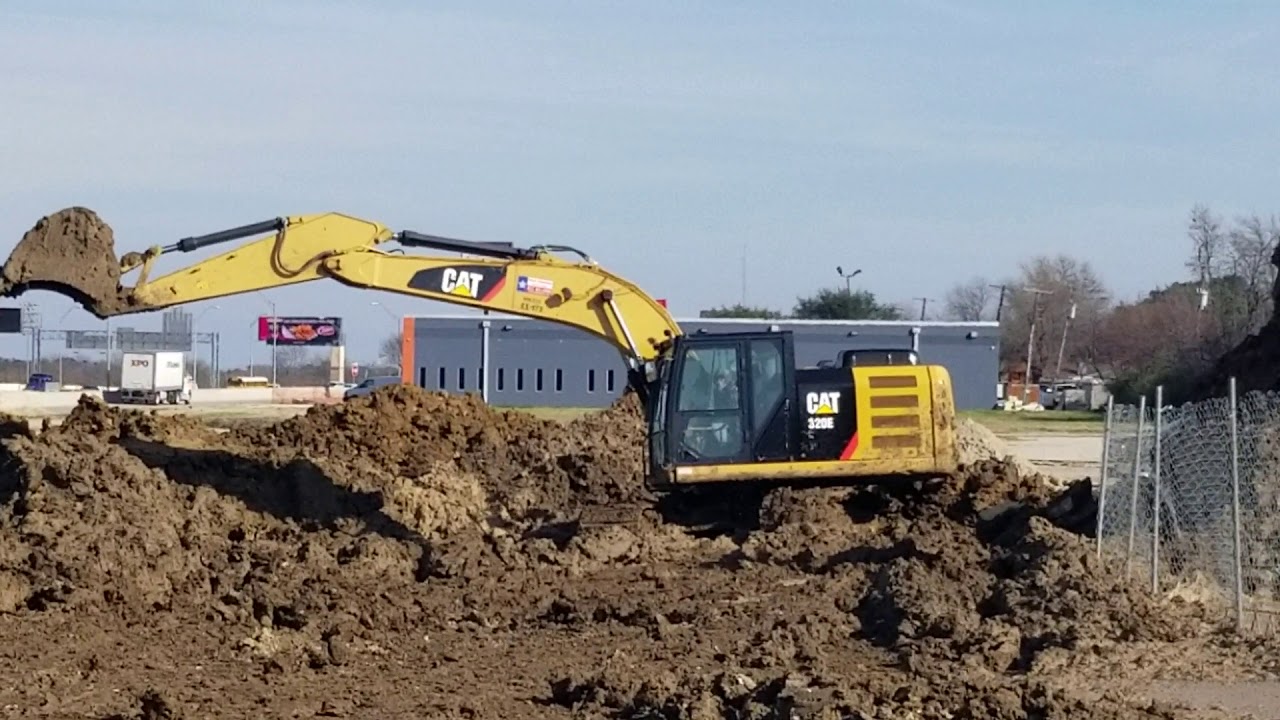 Caterpillar 320EL Excavator working on a job site - YouTube