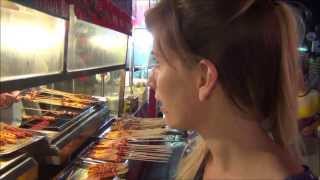 Tour of Yangshuo night life visiting a night market and eating Chinese street food (阳朔夜市和街头食品) China