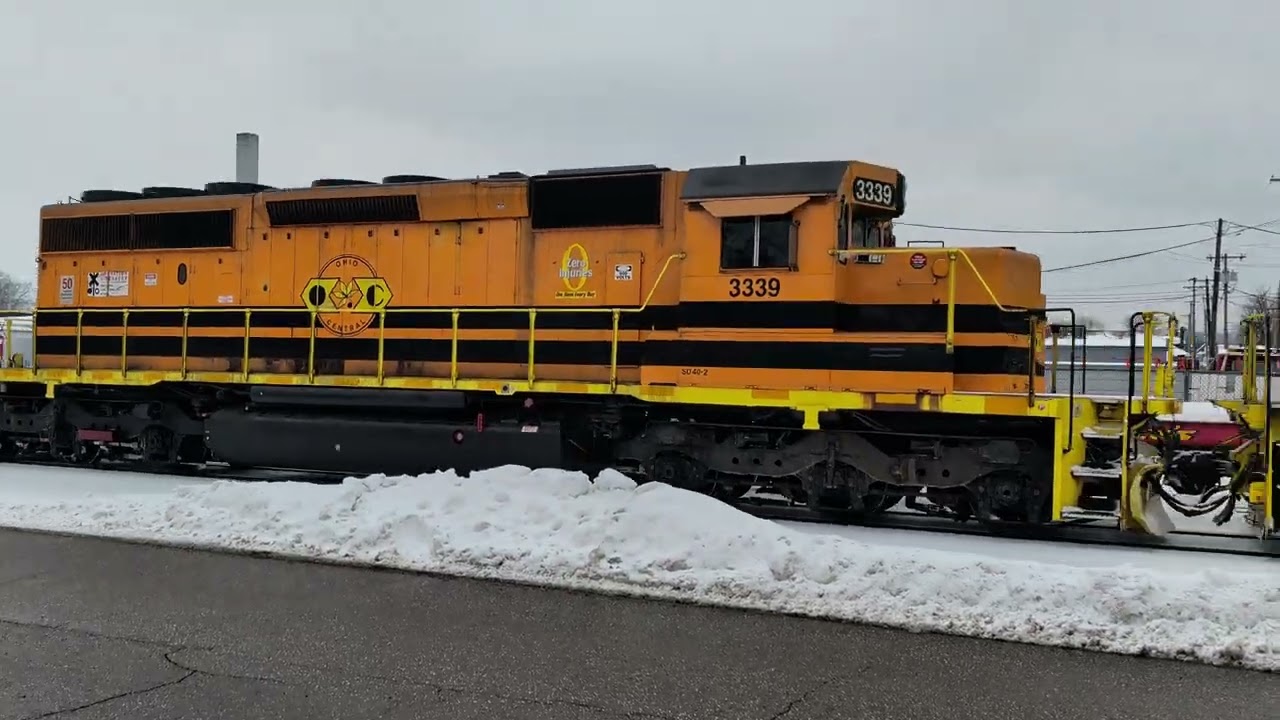 A GP38-2 locomotive and 2 SD40-2 locomotives hauling an OC unit tank train.