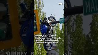 Motorcycle left hanging from stoplight after Surrey crash