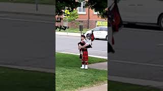 Lone bagpiper at dad's funeral.