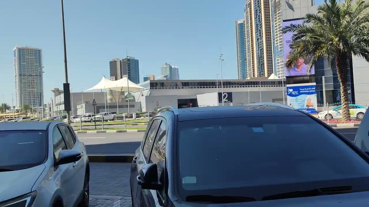 Sharjah Al Taawoun street from store to apartment building 