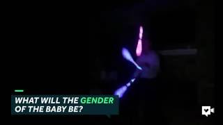 Dad-to-be juggles lighted bowling pins for gender reveal