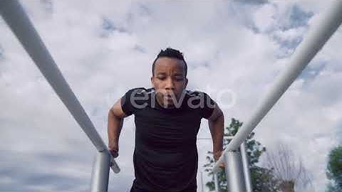 Muscular Afro Man Doing Bodyweight Push Ups on Parallel Bars | Stock Footage - Envato elements