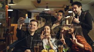 Happy friends are taking selfie while sitting at table with drinks and snacks in cafe. Attractive screenshot 2