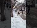 Watch an American police officer slip on the icy street while chasing protesters
