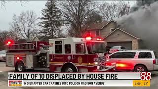 Family of 10 displaced by house fire