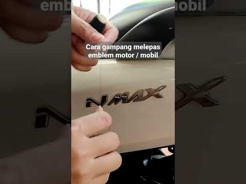 Cara melepas emblem