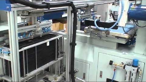 Automatic screen printer for licence plate holders by ACP Systems Sweden