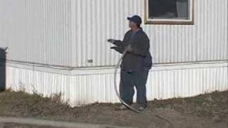 Blowing Insulation Into the Sidewall of a Mobile Home