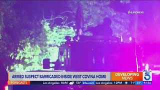 Armed suspect remains barricaded inside West Covina home