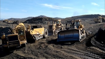 CAT D9 Dozer pushing 651B scrapers - D10T Dozer ripping away