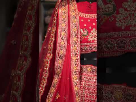 Video The image showcases a vibrant red lehenga choli displayed on a mannequin,