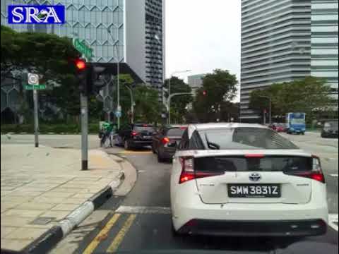 Grabfood delivery rider crossing pedestrian crossing when light is red