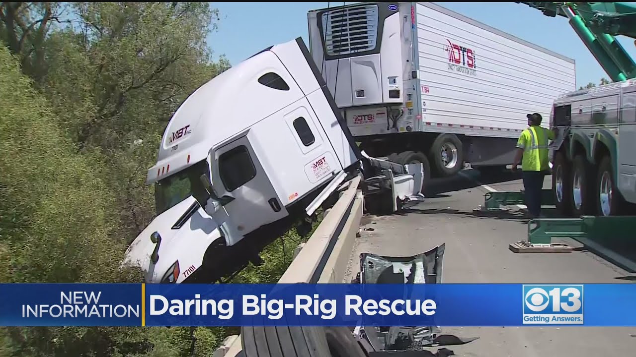 Occupants Saved By Daring Rescue After Big Rig Crashes, Dangles Off ...