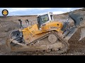 Liebherr PR 776 Bulldozer Pushing over the Quarry Edge