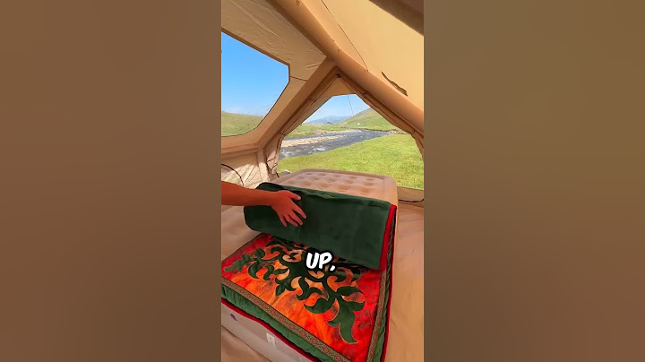 He creates a camping space with an inflatable tent