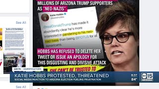 Arizona Secretary of State Katie Hobbs protested, threatened