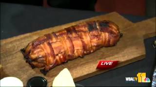 Ava tries pork-stuffed bacon for Heavy Seas event