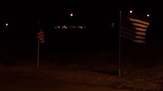 Community members prepare to pay respects to Navy service member