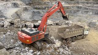 Hitachi Zaxis 470R Excavator is loading soil and rock on the mining area