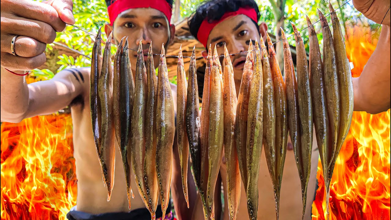 Two Brother Cut Bamboo to Make Grilled Fish in Bamboo Peacock Eel and Dip with Tamarind​ for Lunch
