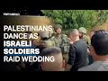 Palestinians dance as Israeli soldiers raid wedding