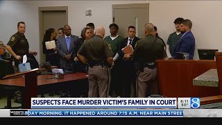 Suspects face murder victim's family in court Profile