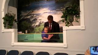 Annalise McKnight getting baptized.