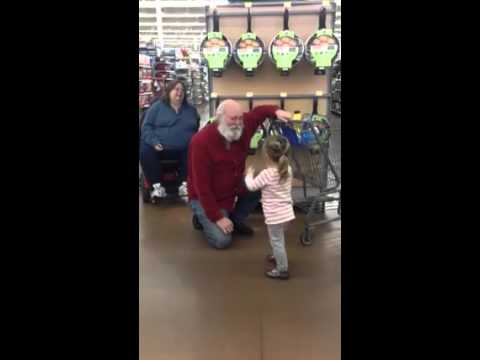 Little girl mistakes a shopper for Santa and he plays along!