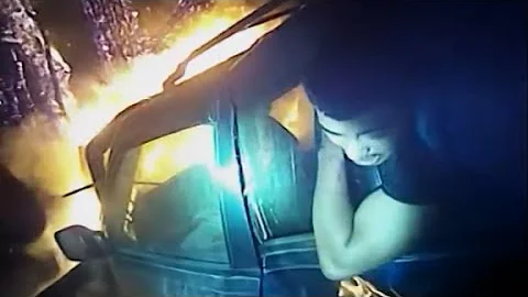 Police officer pulls man from burning vehicle