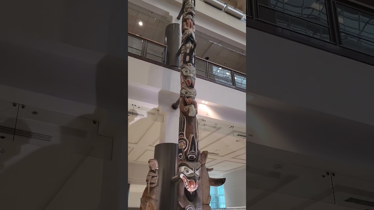 Impressive totem pole showcasing Indigenous art and heritage at Pan Pacific Hotel, Vancouver