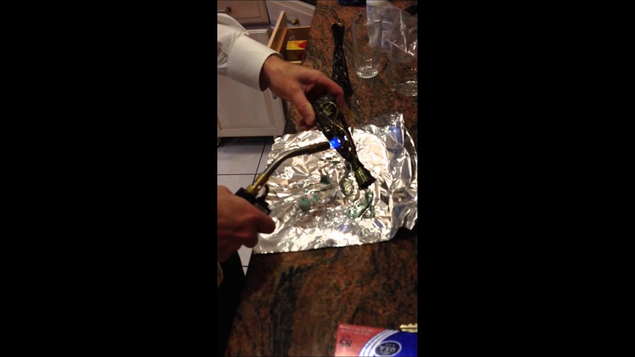 Using a blow torch to get rid of candle wax