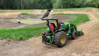 Dredging a farm pond  with compact tractors. Part 2