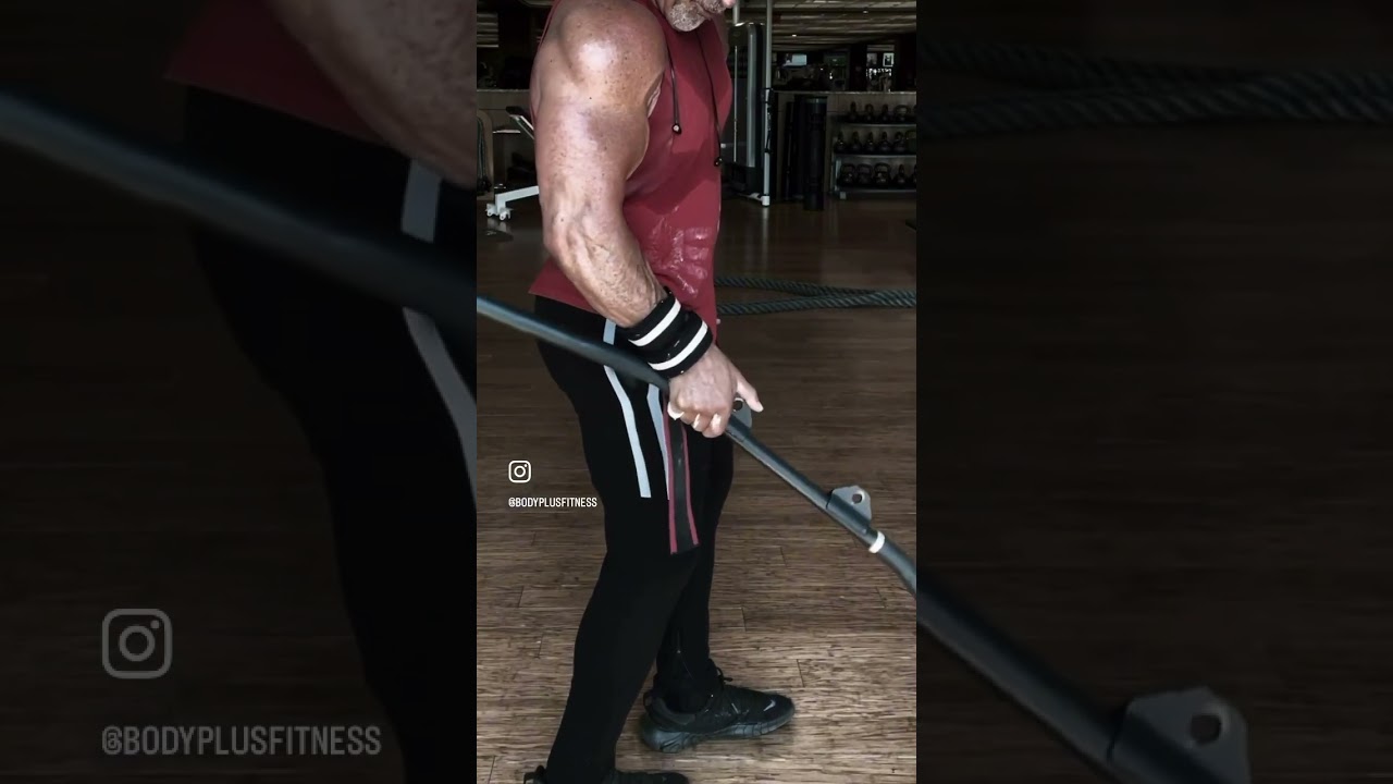 If you’re looking to work your brachial radialis, try this retro lift using a lat pulldown bar.